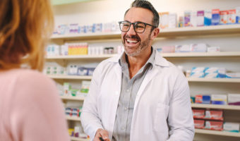 pharmacist smiling at patient